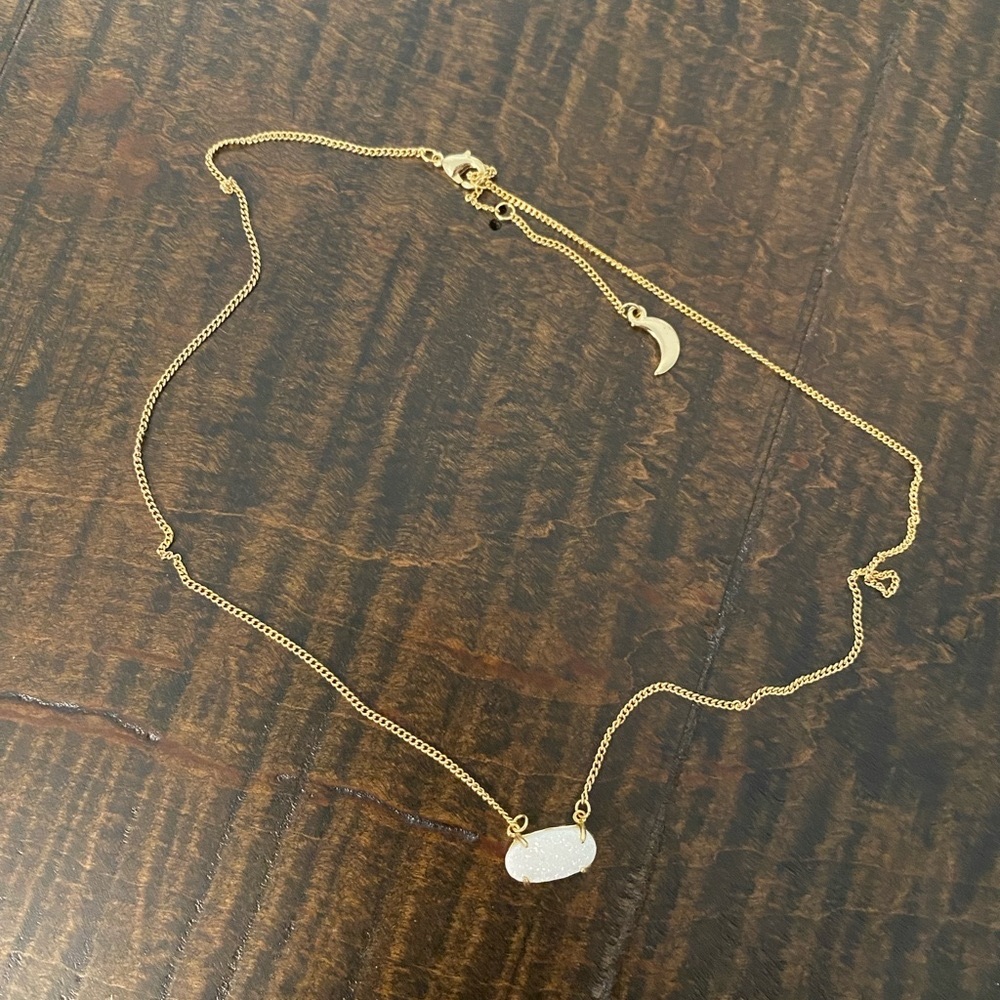 Gold necklace with white pendant